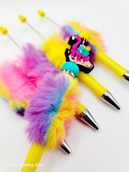 Colorful pens with fluffy accents and a cartoon character on a white background