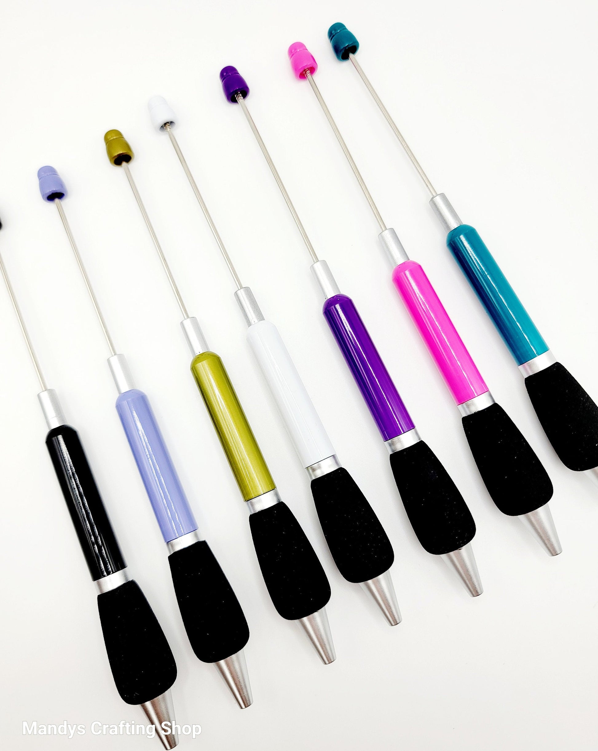 Set of colorful pens on a white background