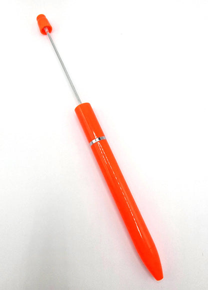 Orange crochet hook with a silver metal shaft on a white background