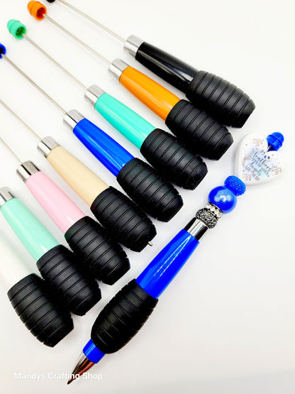 Set of colorful pens with black grips on a white background