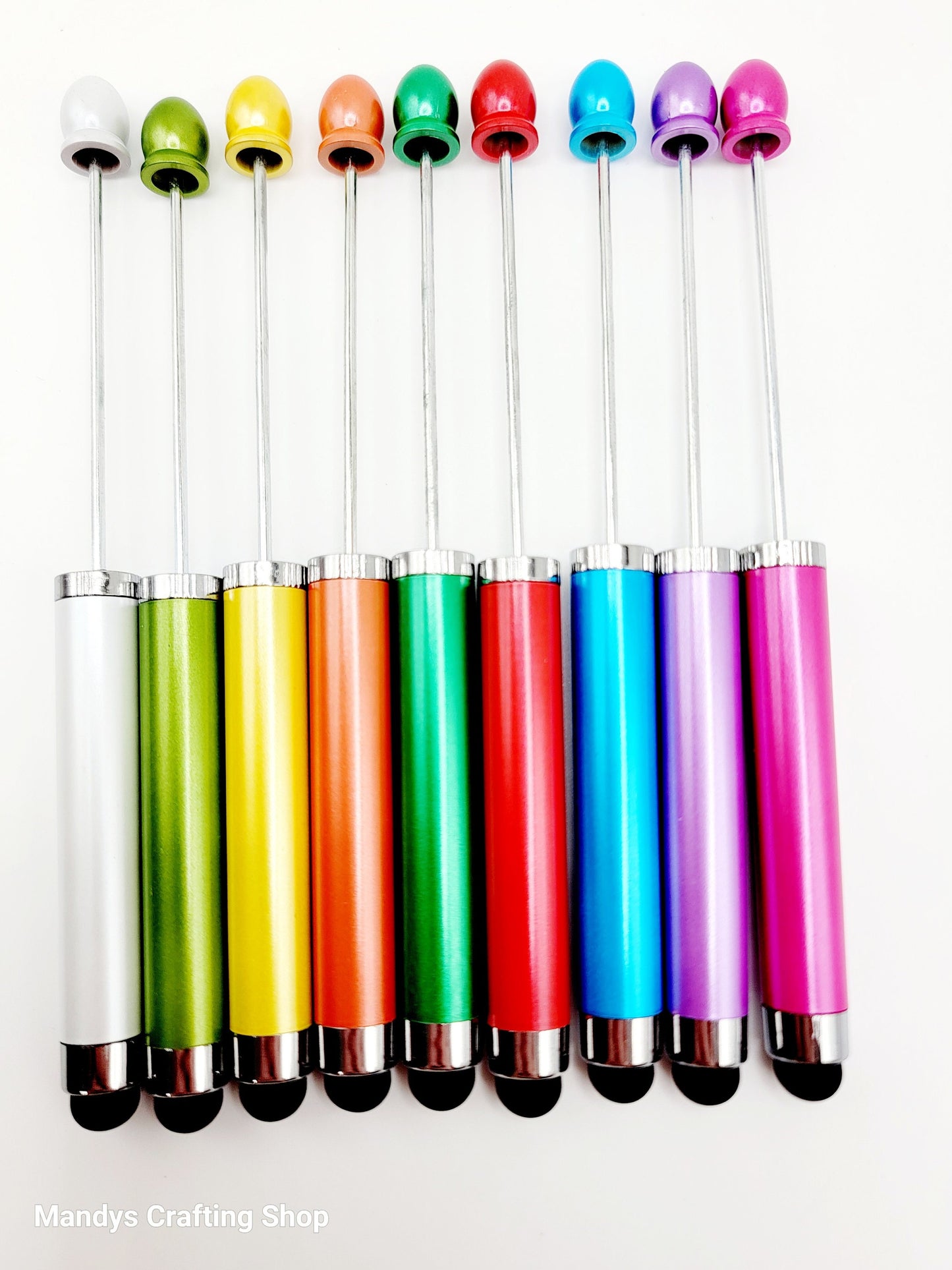 Set of colorful styluses with different colored tips on a white background