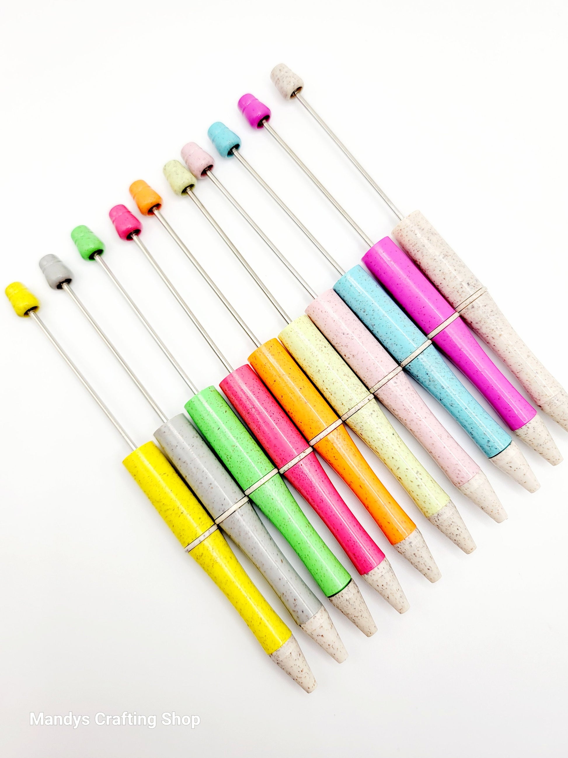 Colorful pens on a white background