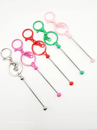 Set of colorful cocktail straws with decorative ends on a white background