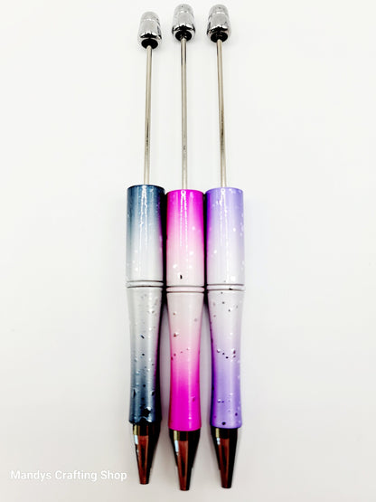 Three gradient pens with a blue, pink, and purple color scheme on a white background.