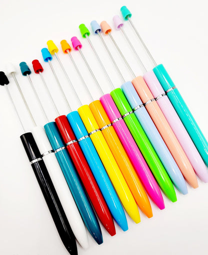 Colorful pens with various colored caps on a white background