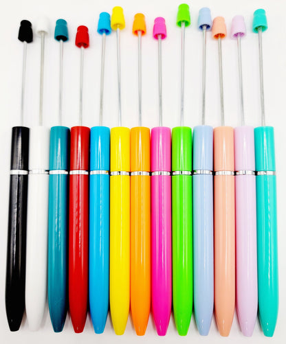 Colorful pens with various colored caps on a white background