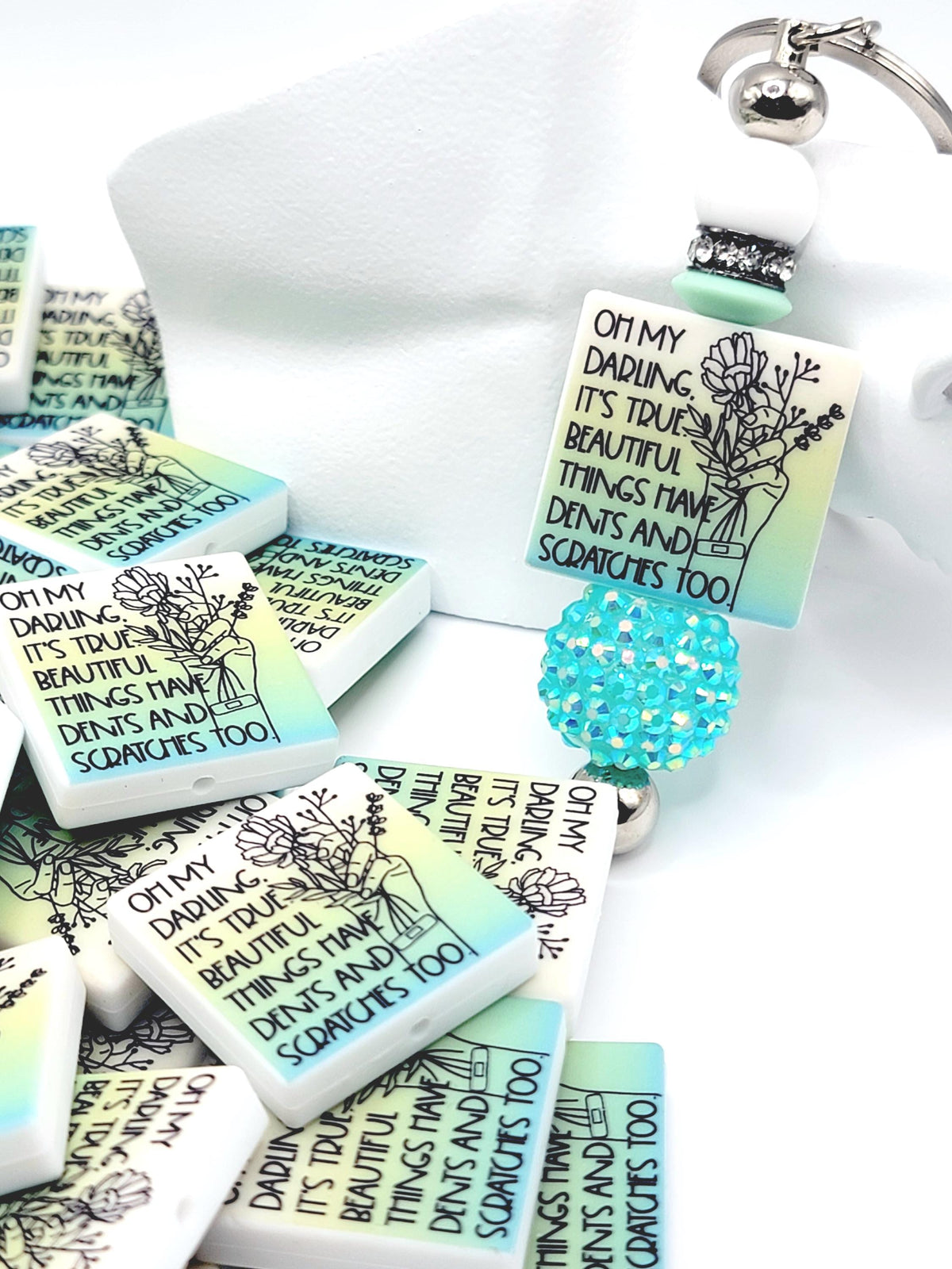 Inspirational focal bead featuring the message “Beautiful Things Have Dents Too” for mental health awareness and DIY beadable pen crafts.