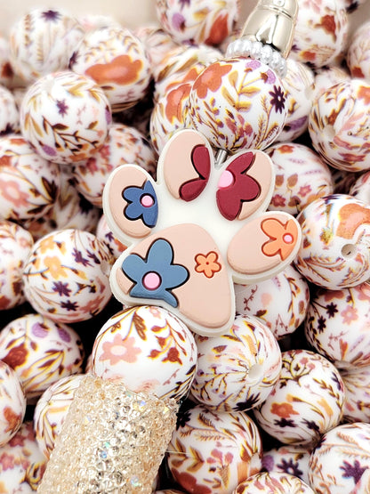 15mm brown floral print silicone round beads with autumn-inspired flower designs for pens, wristlets, keychains, jewelry, and crafts.
