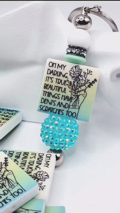 Inspirational focal bead featuring the message “Beautiful Things Have Dents Too” for mental health awareness and DIY beadable pen crafts.